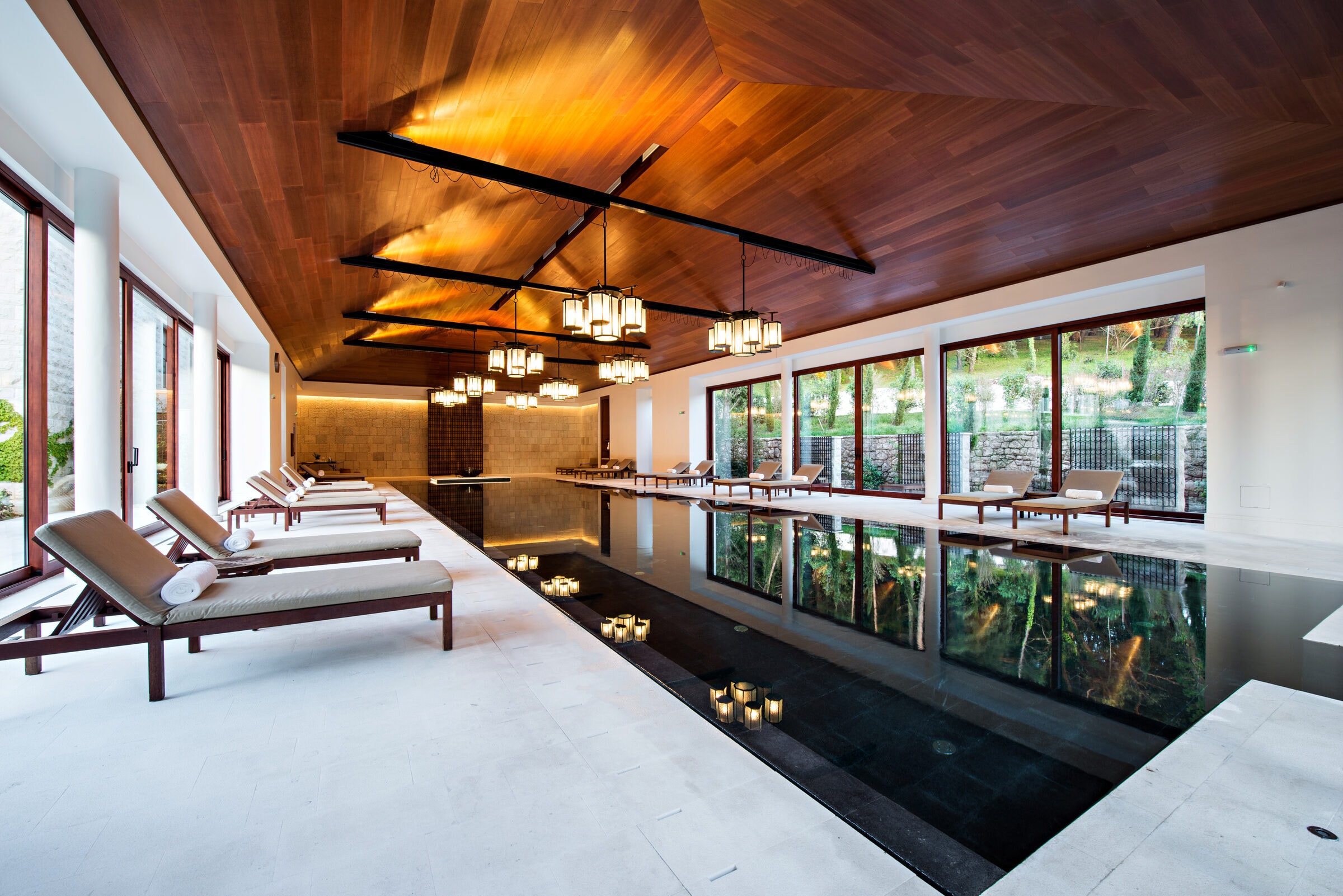Luxury indoor commercial pool in Greater Nashville. Architectural lighting and premium tilework on a Trident-maintained pool environment.