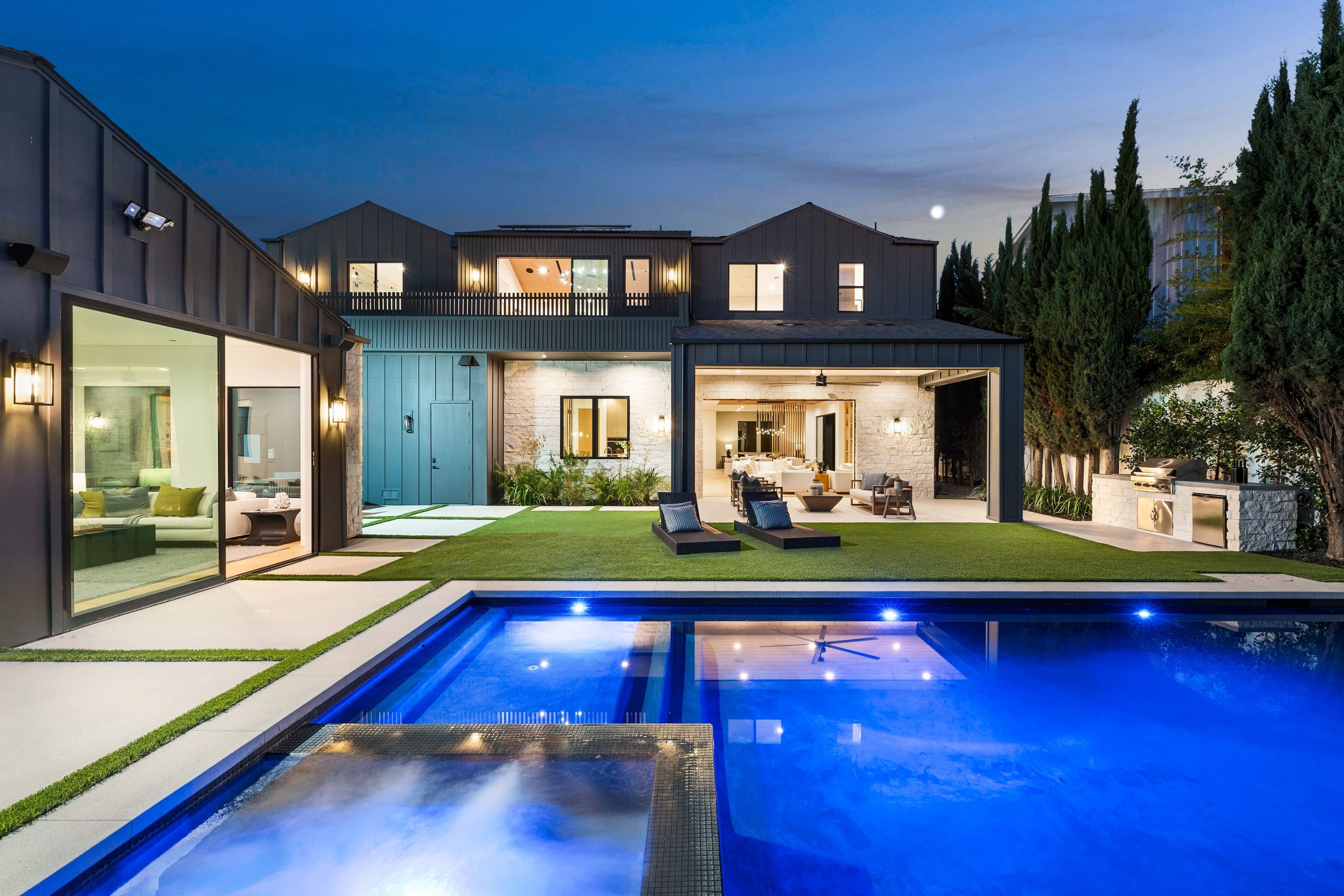 Modern pool with LED lighting at dusk
